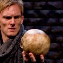 Scott Parkinson as Hamlet gazes at the skull of Yorick and contemplates death in Writers’ Theatre production of Hamlet 2012 credit Michael Brosilow