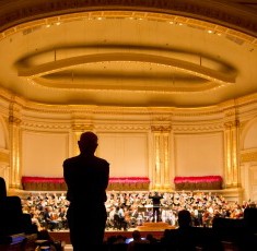 Duaine Wolfe, director of the Chicago Symphony Chorus, listens from the back of Carnegie Hall as the CSO rehearses for the evening concert. Chicago Symphony Orchestra NY Mexico Tour October 2012 credit Todd Rosenberg