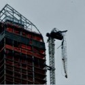 one57 flipped-over crane arm dangles above 57th Street near Carnegie Hall photo by Nancy Malitz