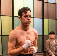 As his trainer (Jason Lindner, left) and father (Norm Woodel, center rear) look on, Joe (Nate Santana) gets a pep talk from Eddie (David Prete). (Michael Brosilow)