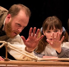 Darwin (Andrew White) shows his children (Caroline Heffernan and John Francis Babbo) the hand-like bones common to various creatures. (Liz Lauren)